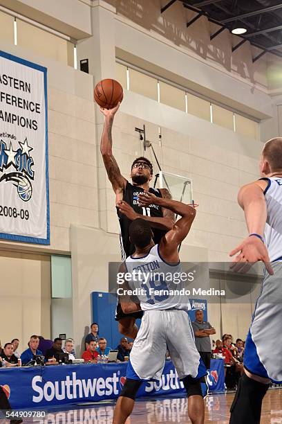 Devyn Marble of the Orlando Magic Blue shoots against Tekele Cotton of the Detroit Pistons during the Orlando Summer League on July 4, 2016 at Amway...