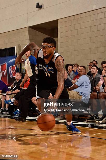Devyn Marble of the Orlando Magic Blue drives to the basket against the Detroit Pistons during the Orlando Summer League on July 4, 2016 at Amway...