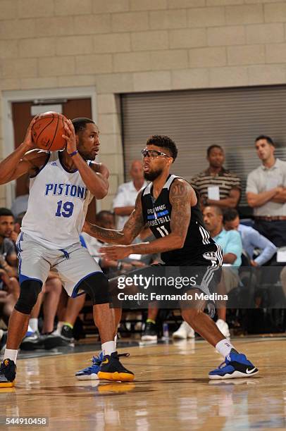 Tekele Cotton of the Detroit Pistons handles the ball against Devyn Marble of the Orlando Magic Blue during the Orlando Summer League on July 4, 2016...