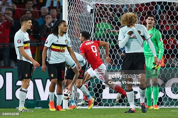 Thomas Meunier of Belgium, Jason Denayer of Belgium, Hal Robson Kanu of Wales , Marouane Fellaini of Belgium, Thibaut Courtois of Belgium during the...