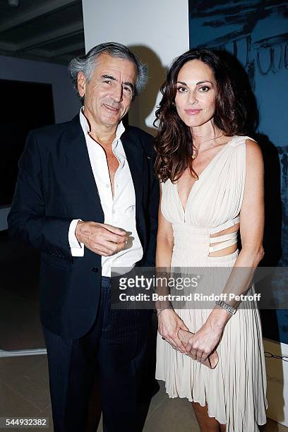 Bernard-Henri Levy and Tasha de Vasconcelos attend "Peshmerga" Private Screening at Galerie Azzedine Alaia on July 4, 2016 in Paris, France.
