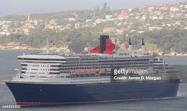 Crowds on the shore and boats on the water greet Queen Mary 2 on March 7, 2010 in Sydney, Australia. The largest ship to ever visit Australia,...