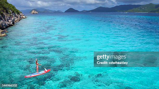 aerial view of woman on paddleboard - caribbean dream stock pictures, royalty-free photos & images