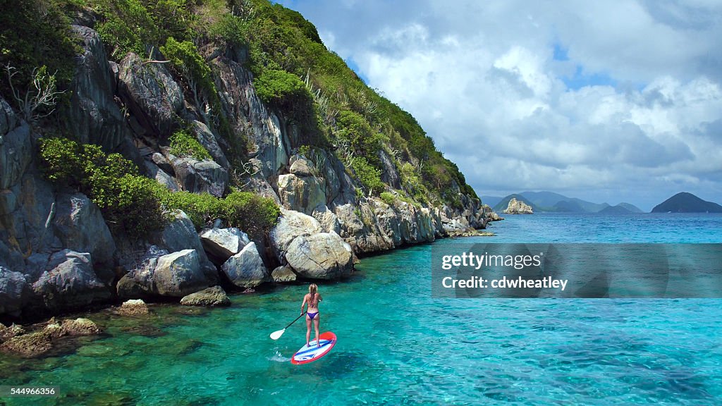 Aerial view of woman on paddleboard