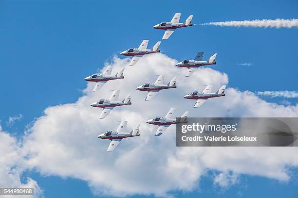 snowbirds in blue sky and clouds - royal canadian air force stock pictures, royalty-free photos & images
