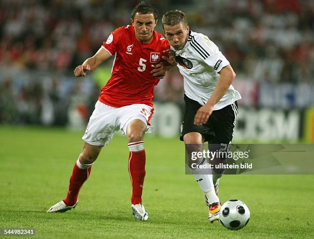 Austria - Klagenfurt: UEFA EURO 2008 - Group B, Germany v Poland 2:0 - Lukas Podolski battling for the ball with Poland's Dariusz Dudka