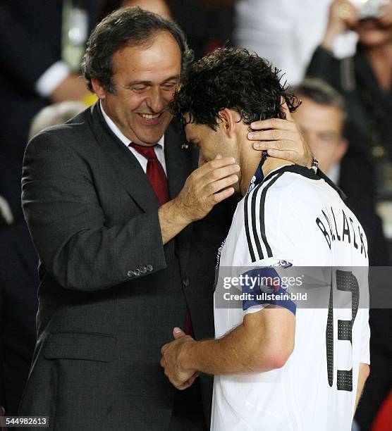 Platini, Michel - President, UEFA, France - and German Michael Ballack after the lost final Germany - Spain at the Ernst Happel Stadium in Vienna...