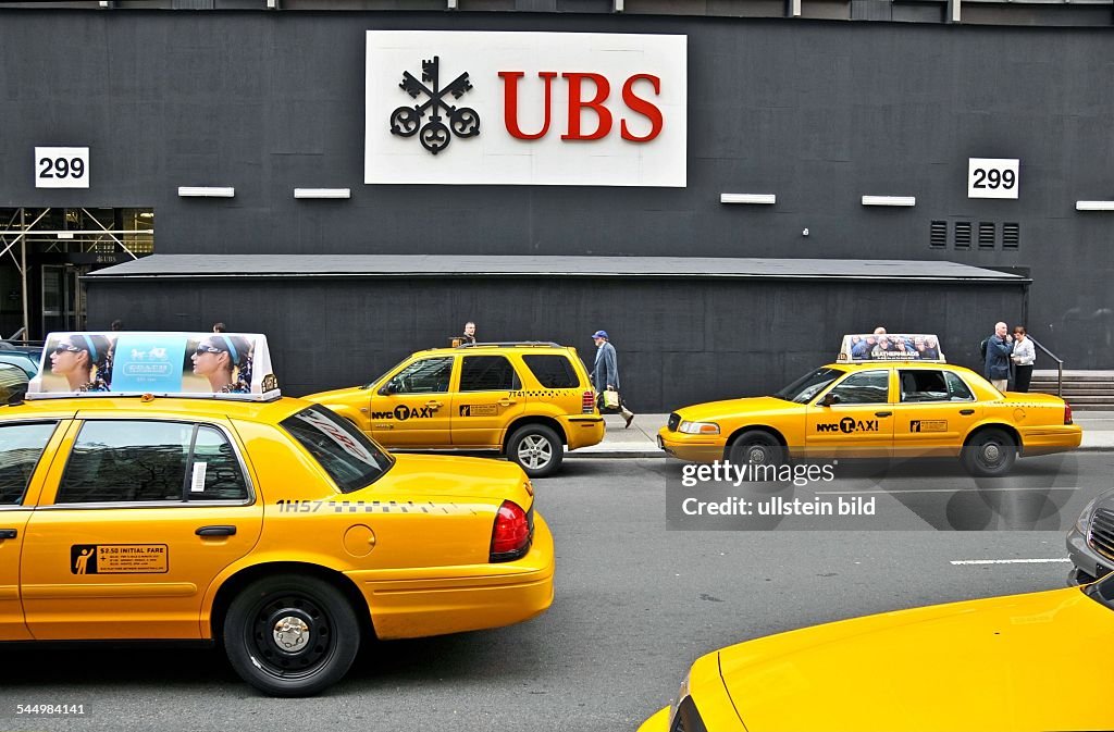 USA - New York City: Yellow cabs in front of the branch of the swiss UBS Bank in Manhattan