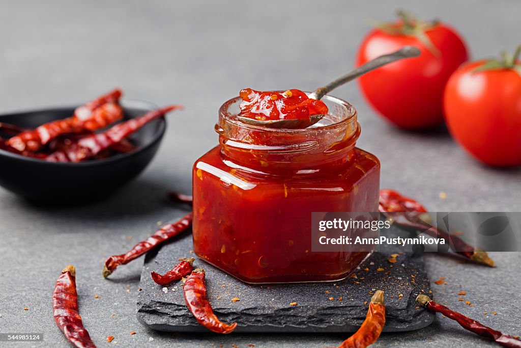 Tomato and chili sauce, jam, confiture in a glass jar