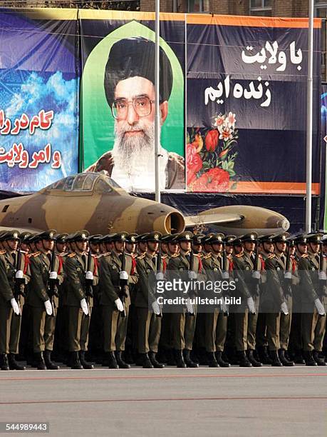 Iran - Teheran Tehran: Officers and soldiers of the iranian army during a parade. In the background a picture of Ayatollah Ali Khamenei