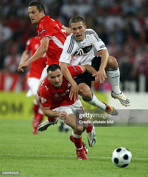 Austria - Klagenfurt: UEFA EURO 2008 - Group B, Germany v Poland 2:0 - Lukas Podolski challenging Poland's Marcin Wasilewski and Dariusz Dudka