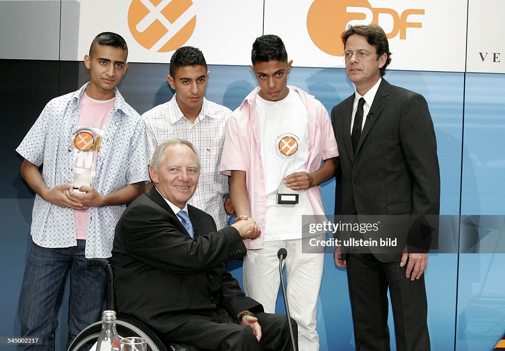 Wolfgang Schaeuble - Politician, Federal Minister of the Interior, CDU, Germany - at the XY- Award "together against the crime", the laureates Mohamed Iraki, Walid Iraqui and Khalil Sabra (from left to right)
