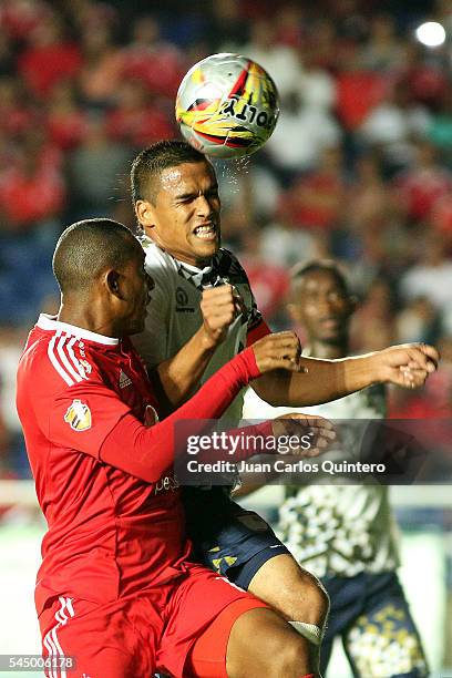 Jose Barriosnuevo of Atletico FC and Alejandro Peñaranda of America de Cali jump for a header during a match between Atletico FC and America de Cali...