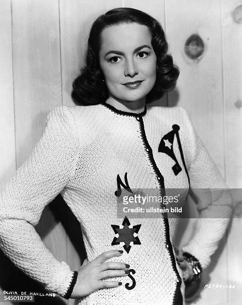 Havilland, Olivia de *-Schauspielerin, USA- Halbportrait, traegt eine Strickjacke- undatiert