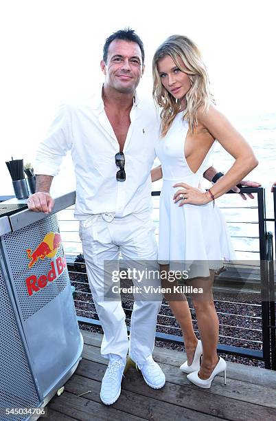 Romain Zago and model Joanna Krupa attend the "Red, White and Bootsy" 4th Of July Event at Nobu Malibu on July 4, 2016 in Malibu, California.