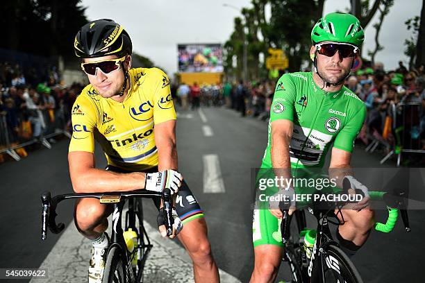 Slovakia's Peter Sagan , wearing the overall leader's yellow jersey, and Great Britain's Mark Cavendish, wearing the best sprinter's green jersey,...