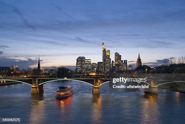 Germany - Hesse - Frankfurt am Main: Skyline - banking district, in the foreground illuminated Ignatz Bubis bridge over river Main