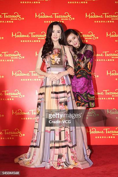 Actress Yang Mi poses with her wax figure at Beijing Madame Tussauds Wax Museum on July 5, 2016 in Beijing, China.