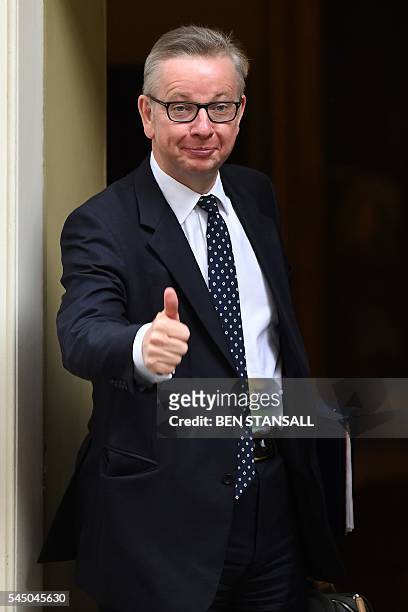 British Lord Chancellor and Justice Secretary Michael Gove gestures as he arrives to attend a cabinet meeting at 10 Downing Street in central London...