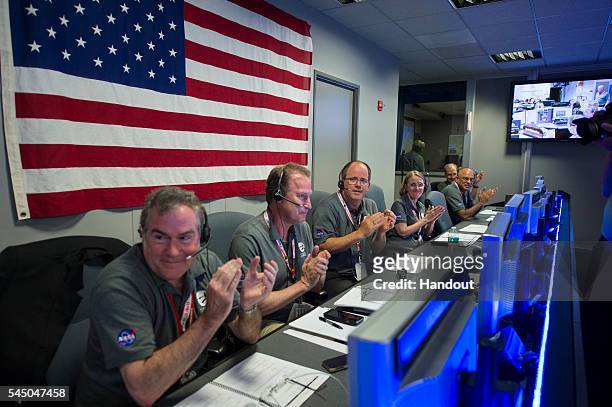 In this NASA handout, From left to right, Michael Watkins, director, NASA's Jet Propulsion Laboratory ; Rick Nybakken, Juno project manager, Jet...