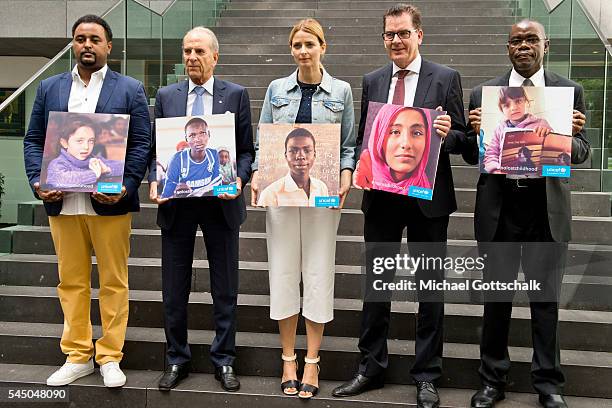 Musician Fetsum, Juergen Heraeus, head of unicef Germany, unicef ambassador Eva Padberg, German Development Minister Gerd Mueller and Cornelius...