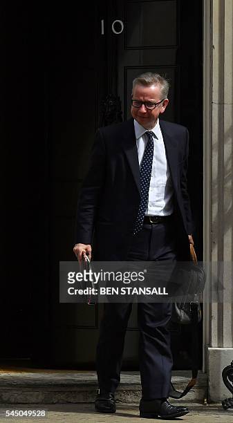 British Lord Chancellor and Justice Secretary Michael Gove reacts as he leavs after attending a cabinet meeting at 10 Downing Street in central...