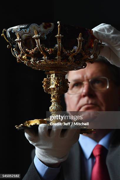 Godfrey Evans holds The Hamilton Rothschild Tazza during the opening of a major new development at the National Museum of Scotland on July 5, 2016 in...