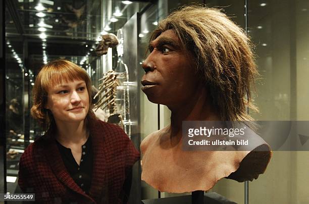 Germany - Berlin - : visitor is looking at the head of a Neanderthal man -