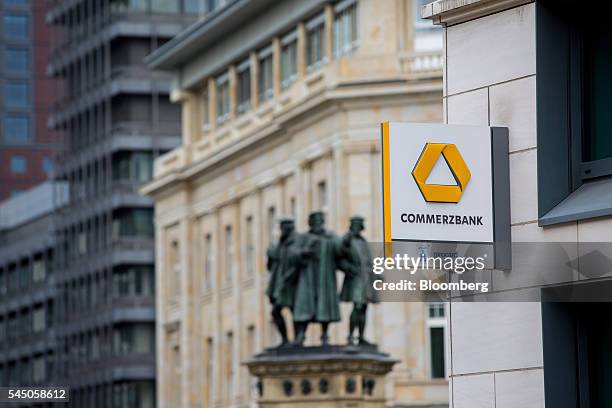 The Commerzbank AG logo sits on a sign outside a bank branch in Frankfurt, Germany, on Monday, July 4, 2016. The British seat at the European Union...