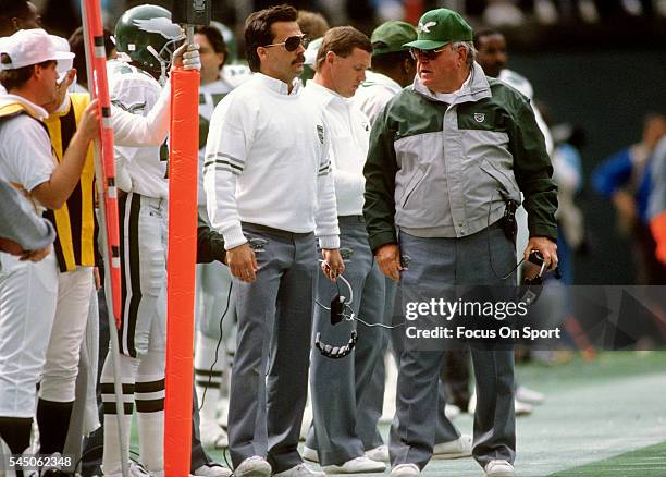 Head Coach Buddy Ryan and defensive coordinator Jeff Fisher of the Philadelphia Eagles looks on from the sidelines during an NFL football game circa...