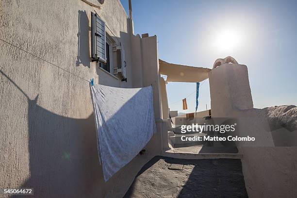 sheets hanging on wall of small greek village, greece - draped sheet stock pictures, royalty-free photos & images