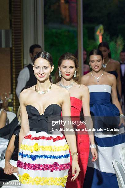 Models walk the runway during the "Sunny Side of Life" By Piaget : Launch Partyshow as part of Paris Fashion Week on July 4, 2016 in Paris, France.