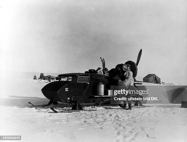 German geophysicist and meteorologist. Photographed packing his sled during his final expedition to Greenland, November 1930.