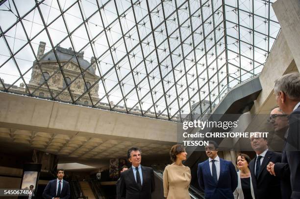 French Foreign Minister Jean-Marc Ayrault, head of the Louvre museum Jean-Luc Martinez, French President Francois Hollande, United Arab Emirates...