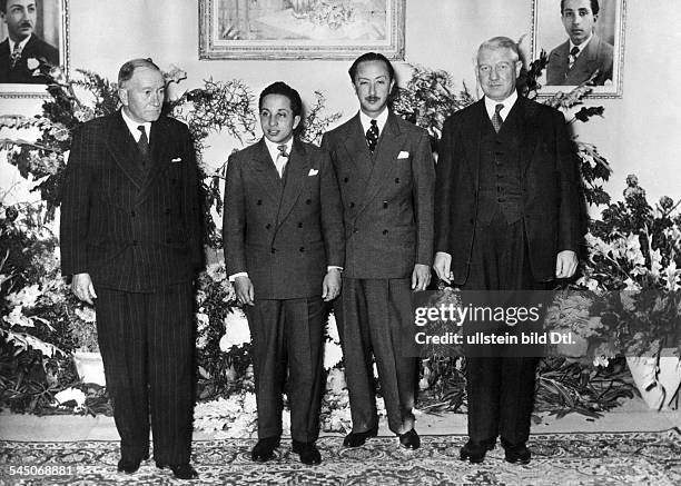 Faisal II. *-+King of Iraq 1939-58Faisal II visiting the Iraq Petroleum Group of Companies in Kirkuk; L-R: Admiral Sir John Cunningham , Faisal II,...