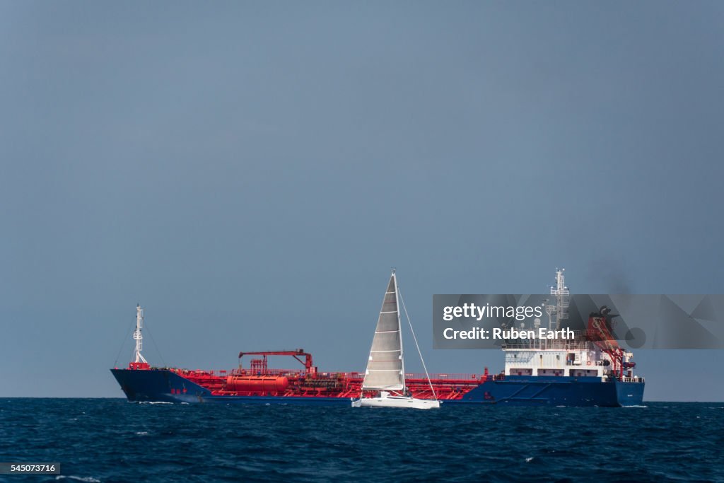 Oil Chemical tanker and sailboat