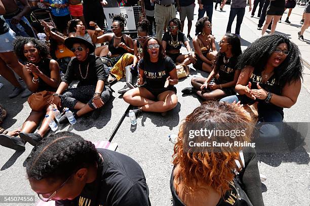 Black Lives Matter Toronto hold a sit-in at Yonge Street and College Street that stalled Toronto's annual Pride Parade.