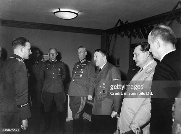 Hans-Ulrich Rudel, officer, colonel, Germany - Adolf Hitler handing the "Goldene Eichenlaub" to him at head quarter "Adlerhorst" f.r.: Karl Doenitz,...