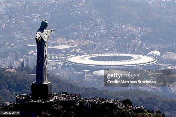 Aerial view of Christ the Redeemer with Maracana Stadium in the background in preparation for the 2016 Olympic Games on July 4, 2016 in Rio de...
