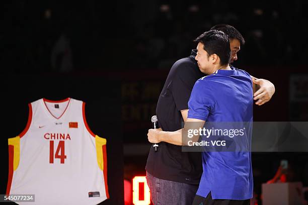 Basketball player Wang Zhizhi and NBA star Yao Ming attend Wang Zhizhi's retirement ceremony during a match of the Stankovic Continental Cup 2016 on...