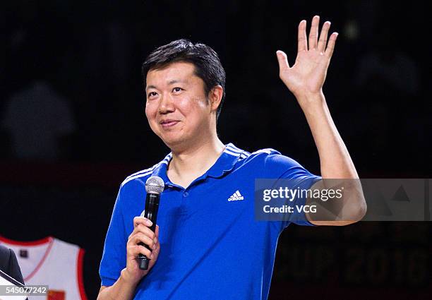 Basketball player Wang Zhizhi waves at his retirement ceremony during a match of the Stankovic Continental Cup 2016 on July 5, 2016 in Beijing,...