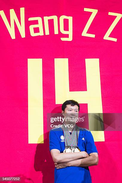 Basketball player Wang Zhizhi poses at his retirement ceremony during a match of the Stankovic Continental Cup 2016 on July 5, 2016 in Beijing,...