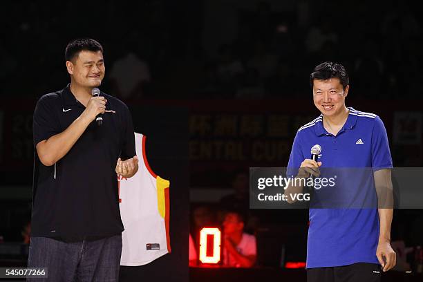 Basketball player Wang Zhizhi and NBA star Yao Ming attend Wang Zhizhi's retirement ceremony during a match of the Stankovic Continental Cup 2016 on...