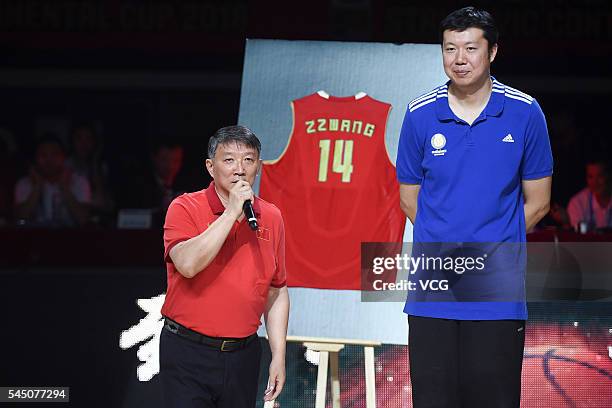 Basketball player Wang Zhizhi and Gong Luming, head coach of China men's national basketball team, attend Wang Zhizhi's retirement ceremony during a...