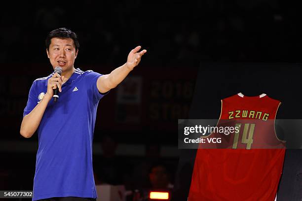 Basketball player Wang Zhizhi speaks at his retirement ceremony during a match of the Stankovic Continental Cup 2016 on July 5, 2016 in Beijing,...