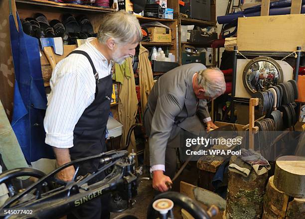 Prince Charles, Prince of Wales visits Trefor Owen's workshop, where Trefor hand makes clogs for dance, leisure and work wear, using traditional...