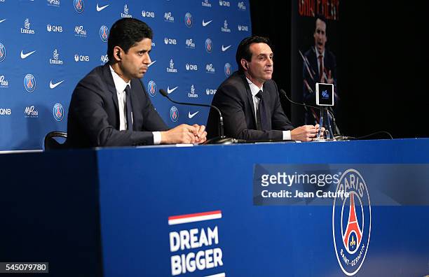 President of PSG Nasser Al-Khelaifi presents Unai Emery of Spain as the new coach of Paris Saint-Germain during a press conference at Parc des...