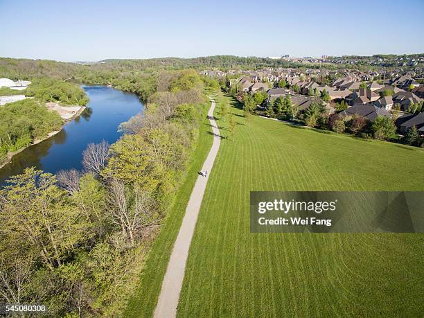 senior couple walking along the river - kitchener canada stock pictures, royalty-free photos & images