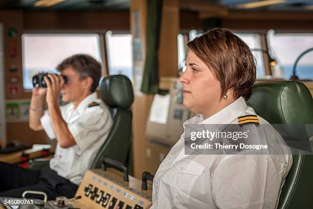 officers ship scrutinizing the sea - ship's bridge imagens e fotografias de stock