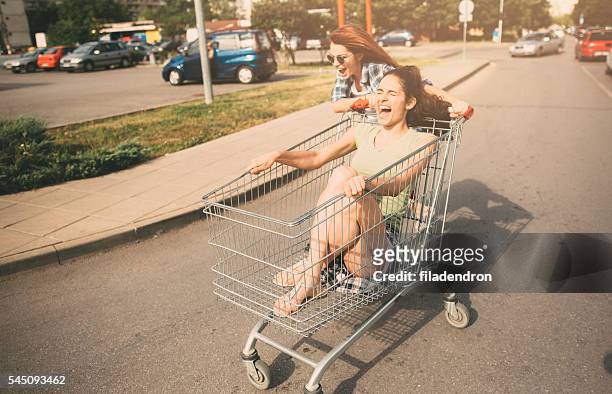 racing with a shopping cart - rebellion stock pictures, royalty-free photos & images